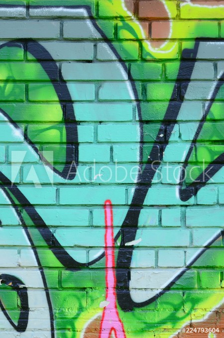 Image de Fragment of graffiti drawings The old wall decorated with paint stains in the style of street art culture Colored background texture in green tones